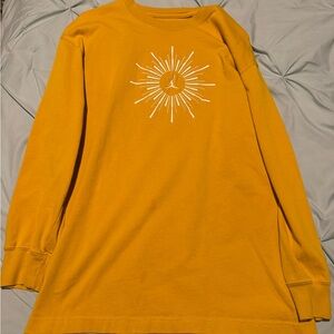 Jordan Flight Yellow Ochre Oversized Long-Sleeve Tee with Sunburst Design